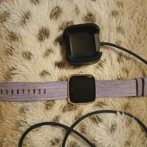 Fitbit Smartwatch with Lavender Strap and Gold Frame